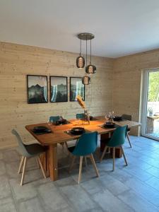 a dining room with a large wooden table and chairs at Ferienhaus Haselnuss in Schleiden