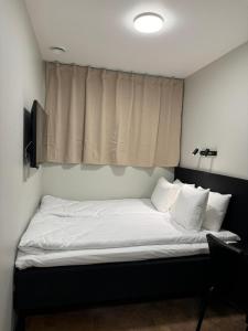 Postel nebo postele na pokoji v ubytování Hotel Hötorget