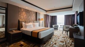 Postel nebo postele na pokoji v ubytování Grand Paragon Hotel Johor Bahru + 37 fotografií
