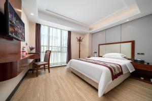 Krevet ili kreveti u jedinici u objektu Honglilai Hotel