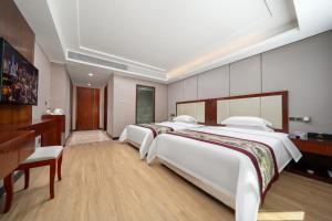 Krevet ili kreveti u jedinici u objektu Honglilai Hotel