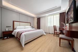 TV i/ili zabavni centar u objektu Honglilai Hotel