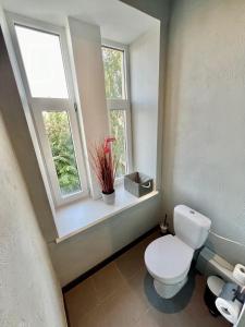 Koupelna v ubytování Primo Hotel