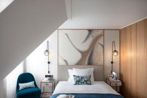 Llit o llits en una habitació de Storchen Zürich - Lifestyle Boutique Hotel