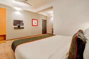 Postel nebo postele na pokoji v ubytování Hotel O Star Key