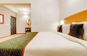 Postel nebo postele na pokoji v ubytování Hotel O Star Key