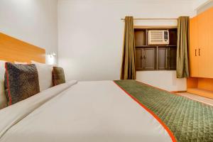 Postel nebo postele na pokoji v ubytování Hotel O Star Key