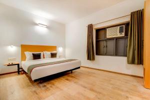 Postel nebo postele na pokoji v ubytování Hotel O Star Key