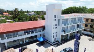 an overhead view of a white building with a red roof at Trinco Caritas Guest Villa in Trincomalee