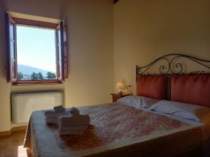 Postel nebo postele na pokoji v ubytování Alba su Assisi + 37 fotografií
