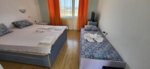 Postel nebo postele na pokoji v ubytování Complex Exotica + 37 fotografií