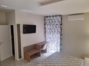 TV a/nebo společenská místnost v ubytování La Violetta + 19 fotografií