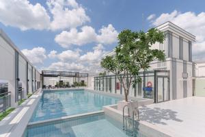 an architectural rendering of a swimming pool on top of a building at SZ Canalside Hotel in Bangkok +21 photos