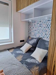 Posteľ alebo postele v izbe v ubytovaní apartament MT burszynowe osiedle