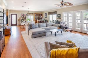 a living room with a couch and a table at Stunning Riverside Retreat with Private Pool home in Port Vincent