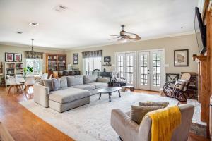 a living room with a couch and a table at Stunning Riverside Retreat with Private Pool home in Port Vincent +32 photos