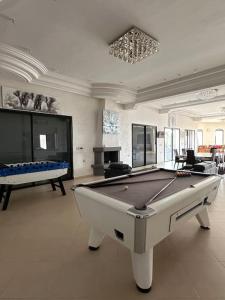 a large room with a pool table in it at Super belle villa avec piscine in Fez