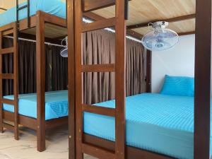 Ένα ή περισσότερα κρεβάτια σε δωμάτιο στο Trinco Beach Resort