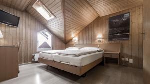 Postel nebo postele na pokoji v ubytování Hotel Rössli