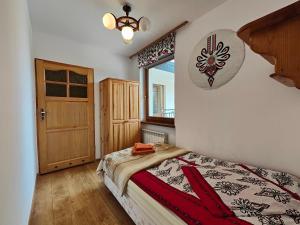 Postel nebo postele na pokoji v ubytování Kompleks Wypoczynkowy Harnaś II + 31 fotografií