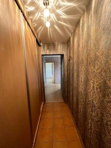 a hallway with a ceiling fan and a hallway with a hallwayngthngthngthngth at Spacious&cozy south apartment in Šiauliai