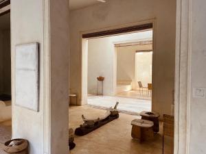 a room with a large window and a room with a room at Swahili Dreams Apartments in Lamu