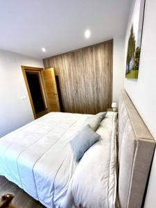 Ένα ή περισσότερα κρεβάτια σε δωμάτιο στο Apartamento la Muralla 2E