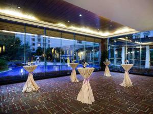 a row of tables in front of a building at Pullman Zhangjiajie Hotel - Instagrammable in Zhangjiajie