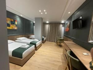 Postel nebo postele na pokoji v ubytování Hotel Monopoly
