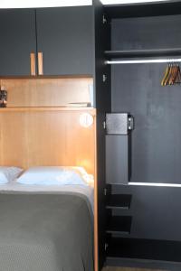 Katil atau katil-katil dalam bilik di Apartamento tranquilo e acolhedor
