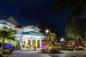 a building with a sign that reads princess casino at night at Port de Plaisance Resort, Trademark Collection by Wyndham in Philipsburg