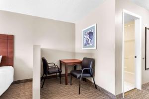 a room with a table and two chairs at Quality Inn & Suites Gorham Riverside in Gorham