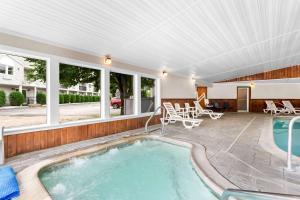 a swimming pool in the middle of a house at Quality Inn & Suites Gorham Riverside in Gorham