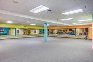 a large empty room with a blue pole in the middle at Quality Inn & Suites Gorham Riverside in Gorham