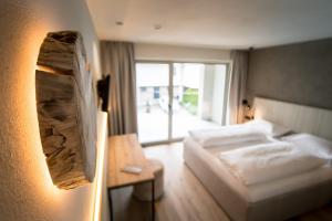 Posteľ alebo postele v izbe v ubytovaní Hotel Sonnenheim