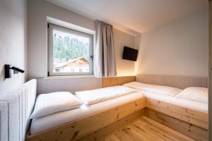 Posteľ alebo postele v izbe v ubytovaní Hotel Sonnenheim