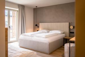 Posteľ alebo postele v izbe v ubytovaní Hotel Sonnenheim
