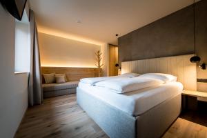 Posteľ alebo postele v izbe v ubytovaní Hotel Sonnenheim