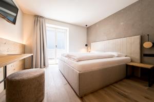 Posteľ alebo postele v izbe v ubytovaní Hotel Sonnenheim