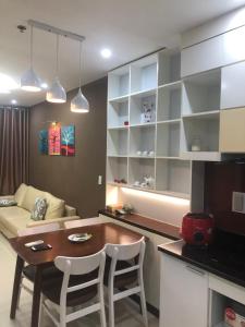 a kitchen and living room with a table and a couch at Happy Apartment-SHP Plaza Lạch Tray in Hai Phong