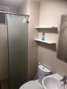 a bathroom with a shower and a toilet and a sink at Happy Apartment-SHP Plaza Lạch Tray in Hai Phong +16 photos