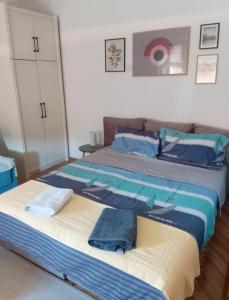 Postel nebo postele na pokoji v ubytování Fina Apartman