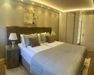 a bedroom with a large bed in a room at Merdan Sarajevo in Sarajevo