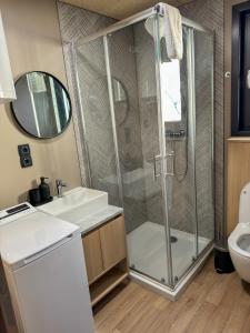 a bathroom with a shower and a sink at Holiday Home Ahil 10 in Pakoštane