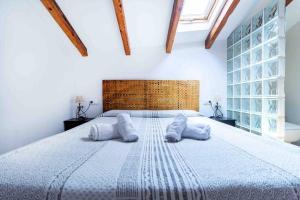 Posteľ alebo postele v izbe v ubytovaní Acogedor Dúplex con terraza interior en la playa
