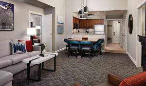 a living room and kitchen with a couch and a table at Marriott Mountainside 2BD in Park City +36 photos