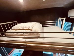 Postel nebo postele na pokoji v ubytování Hostel SAMURISE KURA