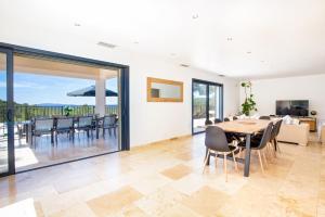 a dining room with a table and chairs at Villa Mas des Lavandes by Villa Plus in Le Tignet