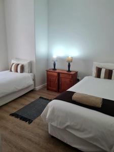 Ένα ή περισσότερα κρεβάτια σε δωμάτιο στο Point Village Accommodation - Erin 5