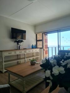 Μια τηλεόραση ή/και κέντρο ψυχαγωγίας στο Point Village Accommodation - Erin 5